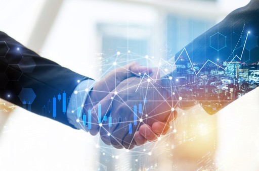 Hands Shaking With Hologram of Data Surrounding